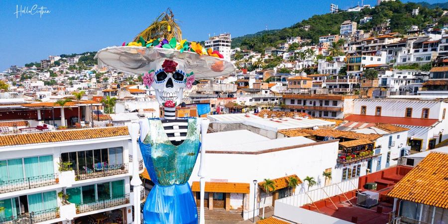 Puerto Vallarta's record-tall catrina, with the old town behind it