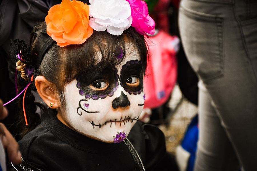 Catrina face paint at a Día de Muertos procession in Mexico