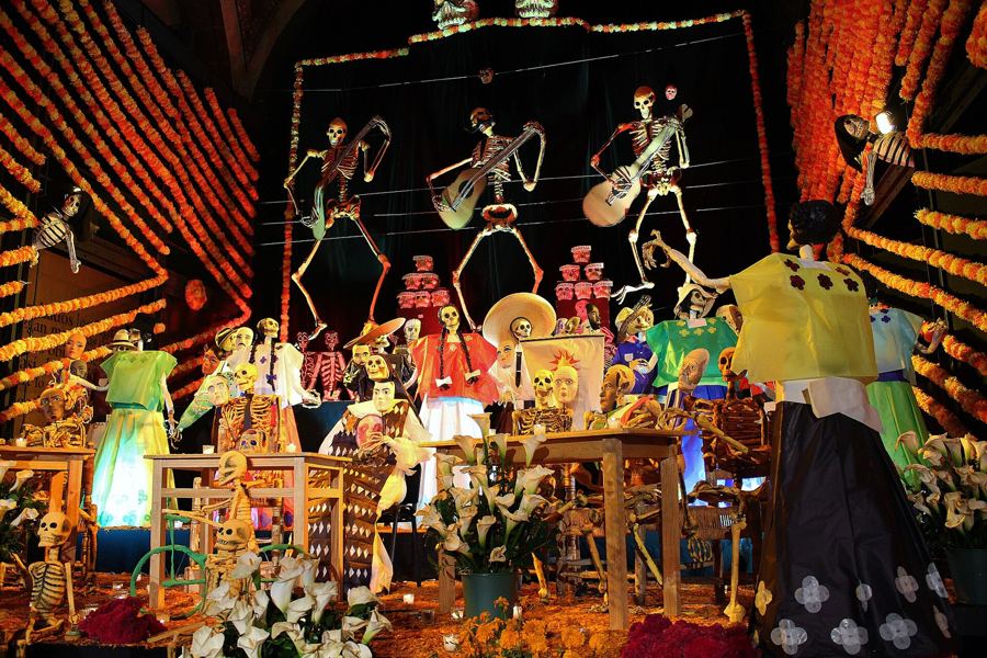 A monumental altar with skeleton musicians